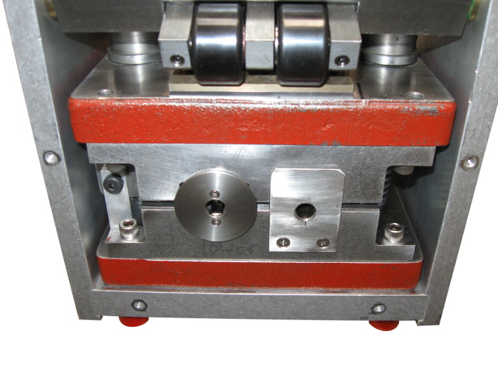 Detailed view of golf club hosel crimper machine